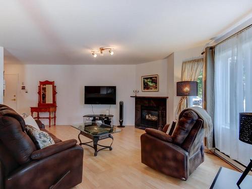 Living room - 204-196 Rue Vanier, Saint-Jean-Sur-Richelieu, QC - Indoor Photo Showing Living Room With Fireplace