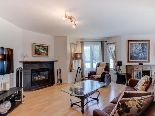 Living room - 204-196 Rue Vanier, Saint-Jean-Sur-Richelieu, QC - Indoor Photo Showing Living Room With Fireplace