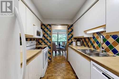 303 - 3734 St Clair Avenue E, Toronto (Cliffcrest), ON - Indoor Photo Showing Kitchen With Double Sink