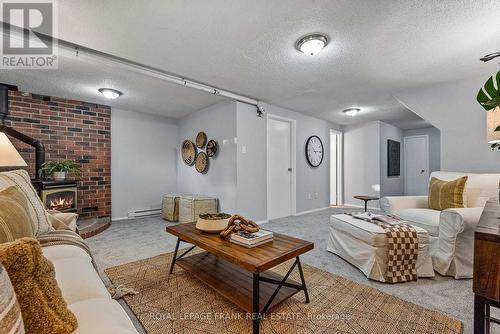 17 - 700 Harmony Road N, Oshawa (Pinecrest), ON - Indoor Photo Showing Living Room With Fireplace