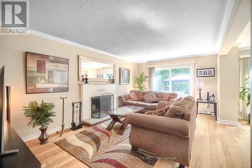 22 - 150 South Service Road, Mississauga, ON - Indoor Photo Showing Living Room With Fireplace