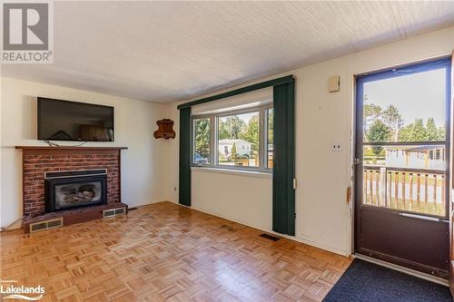 1034 Eighth Lane, Minden, ON - Indoor Photo Showing Living Room With Fireplace