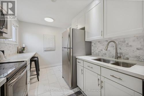 1 - 909 King Street W, Oshawa, ON - Indoor Photo Showing Kitchen With Double Sink With Upgraded Kitchen