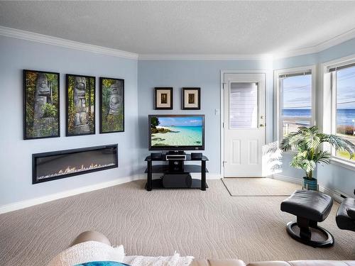 102-3132 Island Hwy West, Qualicum Beach, BC - Indoor Photo Showing Living Room With Fireplace