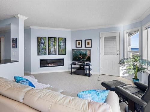 102-3132 Island Hwy West, Qualicum Beach, BC - Indoor Photo Showing Living Room With Fireplace