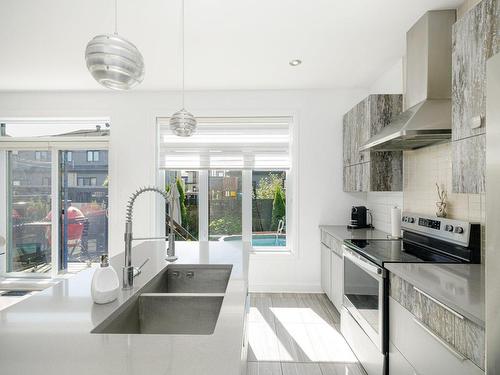 Cuisine - 570 Rue Populaire, Terrebonne (Lachenaie), QC - Indoor Photo Showing Kitchen With Double Sink With Upgraded Kitchen