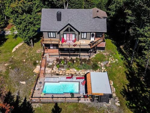 Aerial photo - 11 Ch. Des Fougères, Saint-Sauveur, QC - Outdoor With In Ground Pool With Deck Patio Veranda