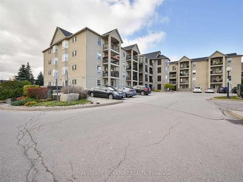 316-1451 Walker'S Line, Burlington, ON - Outdoor With Balcony With Facade