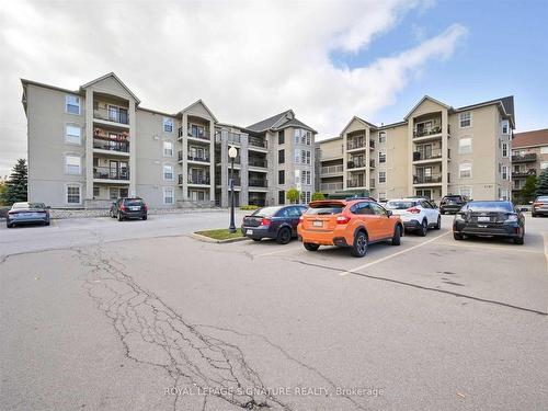 316-1451 Walker'S Line, Burlington, ON - Outdoor With Balcony With Facade