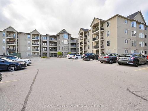 316-1451 Walker'S Line, Burlington, ON - Outdoor With Balcony With Facade