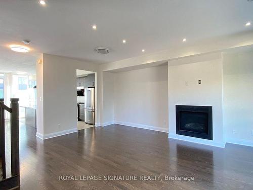 1-5040 Four Springs Ave, Mississauga, ON - Indoor Photo Showing Living Room With Fireplace