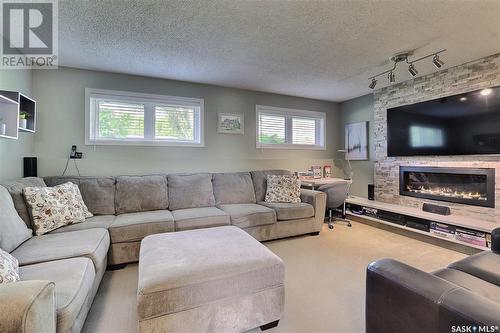 127 Rodenbush Drive, Regina, SK - Indoor Photo Showing Living Room With Fireplace