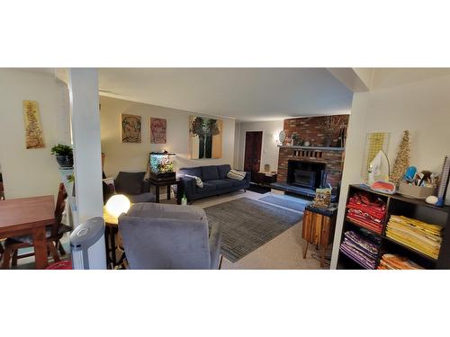 409 9Th Avenue, New Denver, BC - Indoor Photo Showing Living Room With Fireplace