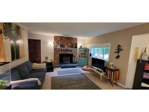 409 9Th Avenue, New Denver, BC - Indoor Photo Showing Living Room With Fireplace