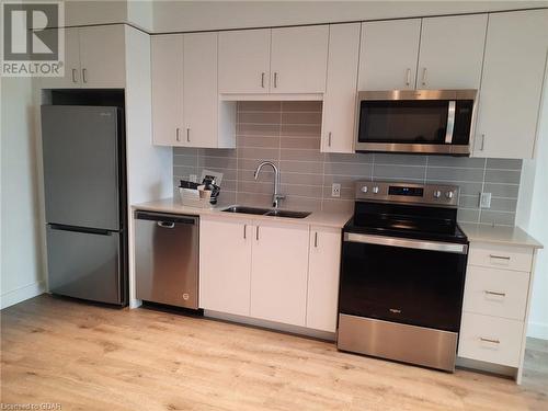 50 Grand Avenue S Unit# 1104, Cambridge, ON - Indoor Photo Showing Kitchen With Stainless Steel Kitchen With Double Sink