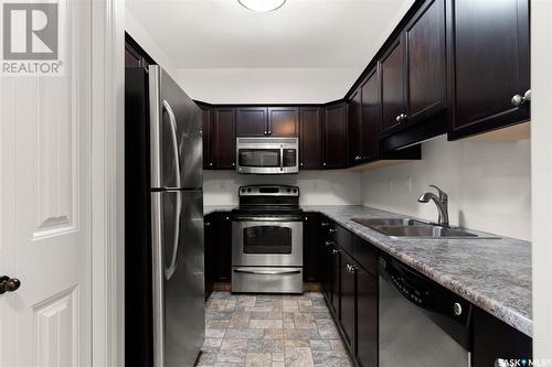 302W 1300 Stockton Street N, Regina, SK - Indoor Photo Showing Kitchen With Double Sink