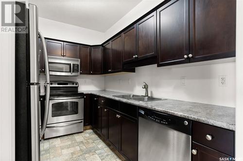 302W 1300 Stockton Street N, Regina, SK - Indoor Photo Showing Kitchen With Double Sink