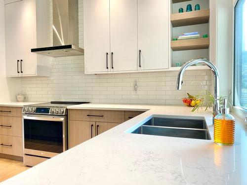 8761 Riverside Drive, Grand Forks, BC - Indoor Photo Showing Kitchen With Double Sink With Upgraded Kitchen