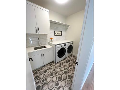 8761 Riverside Drive, Grand Forks, BC - Indoor Photo Showing Laundry Room