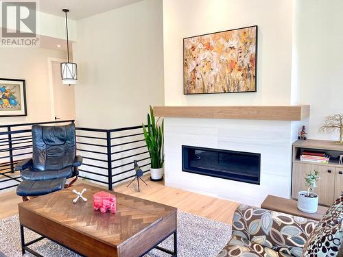 8761 Riverside Drive, Grand Forks, BC - Indoor Photo Showing Living Room With Fireplace