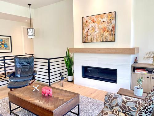 8761 Riverside Drive, Grand Forks, BC - Indoor Photo Showing Living Room With Fireplace