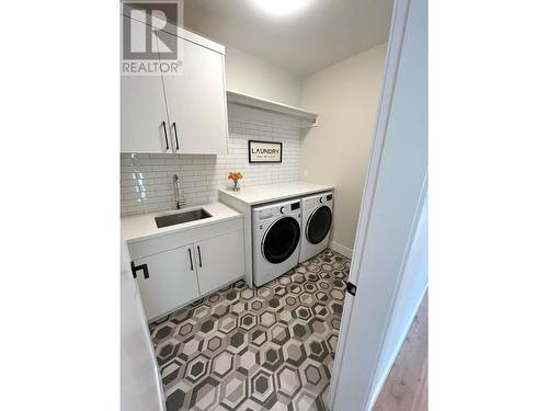 8761 Riverside Drive, Grand Forks, BC - Indoor Photo Showing Laundry Room