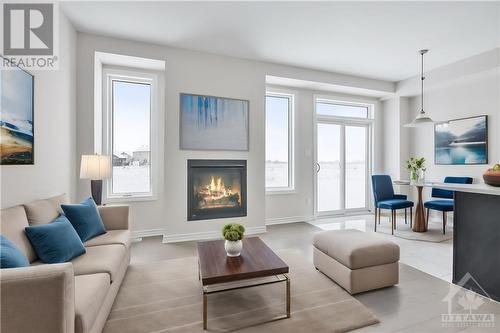 This home has not been built yet. Images provided are to showcase builder finishes. - 1940 Hawker Private, Ottawa, ON - Indoor Photo Showing Living Room With Fireplace