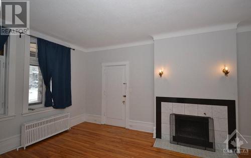 Unit 102 Living Rm - 17 Marlborough Avenue E, Ottawa, ON - Indoor With Fireplace