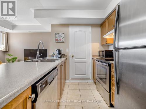 1 - 129 Isaac Devins Boulevard, Toronto (Humberlea-Pelmo Park), ON - Indoor Photo Showing Kitchen With Double Sink