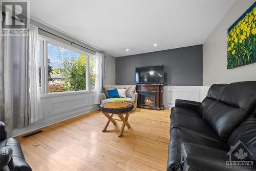 The back yard oasis is sized to fit all your needs! - 1605 Digby Street, Ottawa, ON - Indoor Photo Showing Living Room With Fireplace