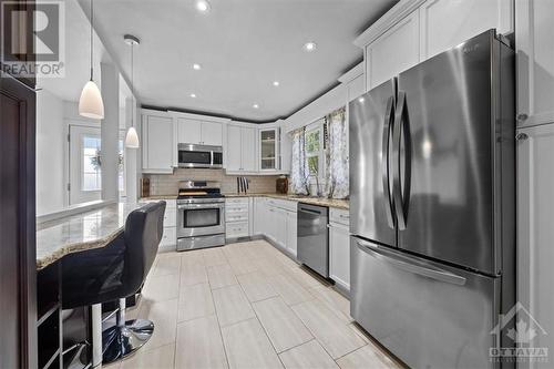 Formal Living room with a large window lets in plenty of natural light - 1605 Digby Street, Ottawa, ON - Indoor Photo Showing Kitchen