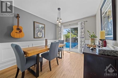 Plenty of natural light and storage in this kitchen with stainless steel appliances and granite counter tops - 1605 Digby Street, Ottawa, ON - Indoor Photo Showing Dining Room