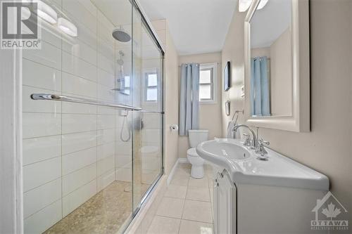 The formal dining room accented with the same wainscotting that extends through the home opens up to the rear yard! - 1605 Digby Street, Ottawa, ON - Indoor Photo Showing Bathroom