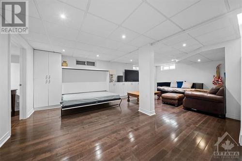 The basement family room is currently set up to watch the big game in comfort and style - 1605 Digby Street, Ottawa, ON - Indoor Photo Showing Other Room