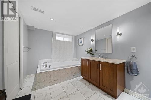 Built ins in the basement include a murphy bed, great for when company extends their stay! - 1605 Digby Street, Ottawa, ON - Indoor Photo Showing Bathroom