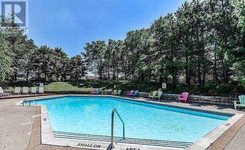 803 - 20 Cherrytree Drive, Brampton (Fletcher'S Creek South), ON - Outdoor With In Ground Pool With Backyard