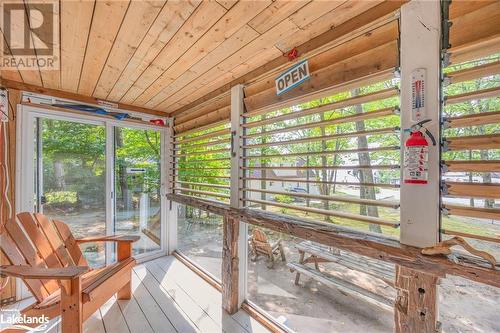 Glass railing with shades for privacy - 739 15 Concession W Unit# 8, Tiny, ON -  Photo Showing Other Room