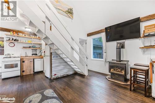 739 15 Concession W Unit# 8, Tiny, ON - Indoor Photo Showing Kitchen With Fireplace