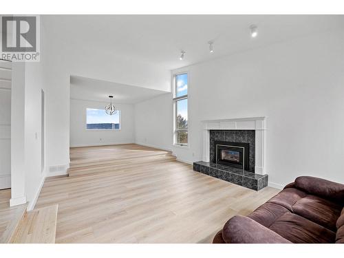 1837 Olympus Way, West Kelowna, BC - Indoor Photo Showing Living Room With Fireplace