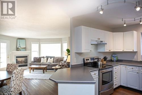 416 Beasley  W Crescent, Nelson, BC - Indoor Photo Showing Other Room With Fireplace