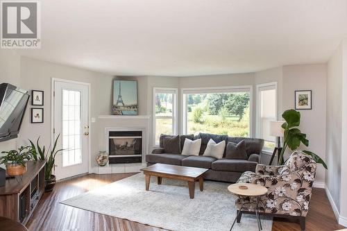 416 Beasley  W Crescent, Nelson, BC - Indoor Photo Showing Living Room With Fireplace