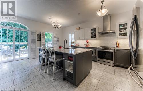 Bright spacious kitchen with sliders out to deck - 89 Hearthwood Crescent, Kitchener, ON - Indoor Photo Showing Kitchen With Upgraded Kitchen