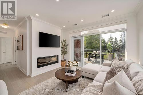 111 - 1560 Upper West Avenue, London, ON - Indoor Photo Showing Living Room With Fireplace