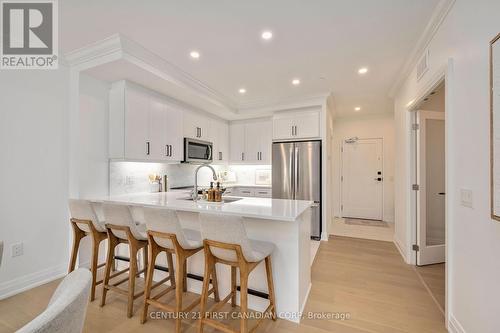 White Barzotti Kitchen - 109 - 1560 Upper West Avenue, London, ON - Indoor Photo Showing Kitchen With Stainless Steel Kitchen With Upgraded Kitchen