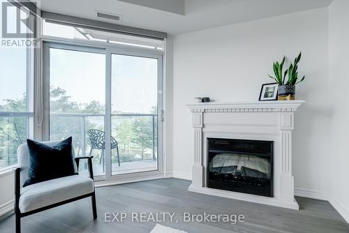 405 - 37 Ellen Street, Barrie, ON - Indoor Photo Showing Living Room With Fireplace