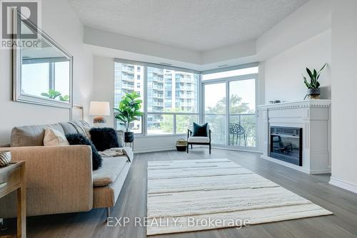 405 - 37 Ellen Street, Barrie (Lakeshore), ON - Indoor Photo Showing Living Room With Fireplace