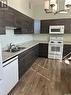 202 3225 13Th Avenue, Regina, SK  - Indoor Photo Showing Kitchen With Double Sink 