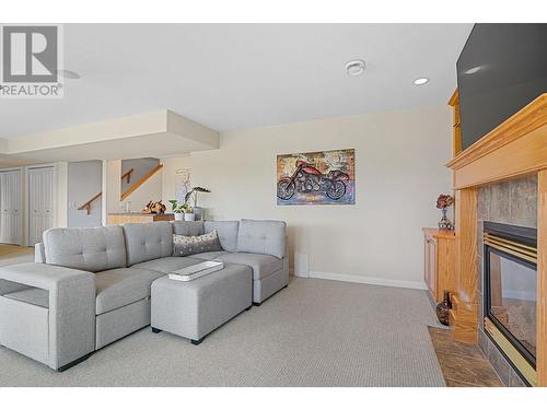 2061 Spyglass Way, Kelowna, BC - Indoor Photo Showing Living Room With Fireplace