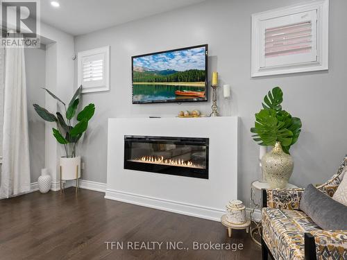 1406 Lawson Street, Innisfil, ON - Indoor Photo Showing Living Room With Fireplace