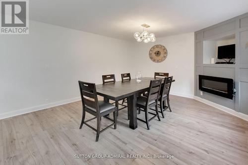 11 Club Court, Wasaga Beach, ON - Indoor Photo Showing Dining Room With Fireplace